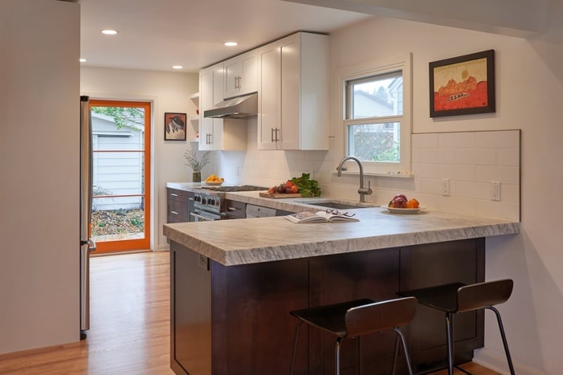 galley kitchen with peninsula breakfast bar